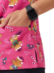 Picture of NNT Uniforms Womens Xmas Gingerbread Surfer Print Scrub Top - Hot Pink (CATUXV-HPK)